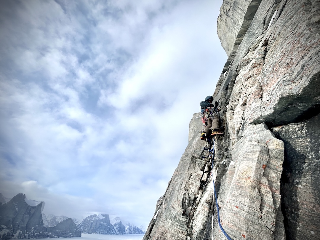Erik Boomer doing a mix of aid climbing and dry-tooling during the first ascent of Sikunga Express (975m, VII WI3 M6 5.10 A4).