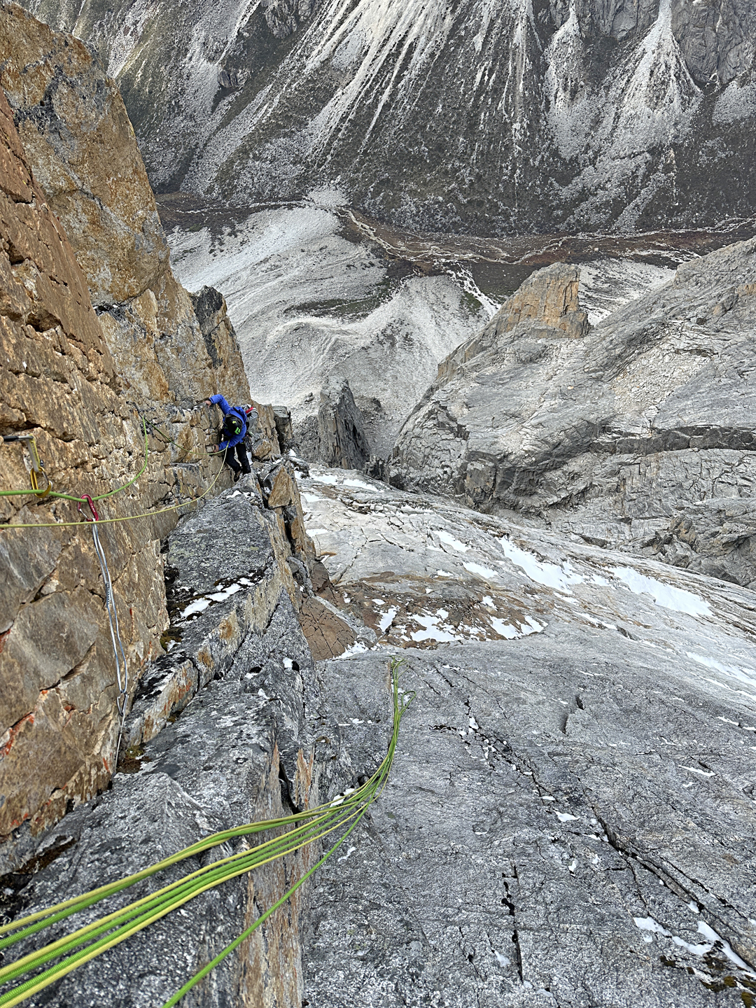 Fanny Schmutz in the upper corner of Grad Kristalov on Peak 5,600m, with the Garmunei Gou below.