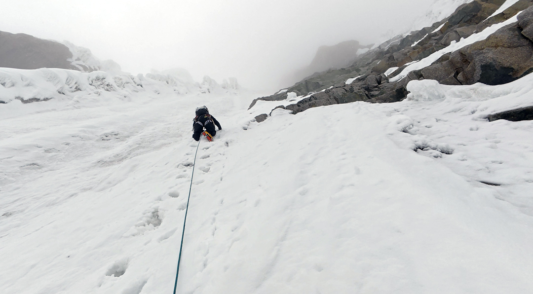 Crusty snow over ice on the east face of Sendho.
