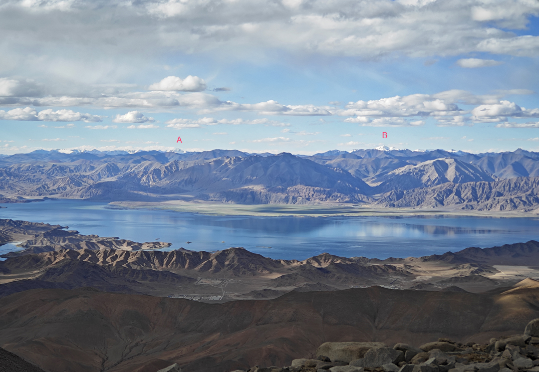 Looking north from the summit area of Lochari across the great Pangong Tso (lake) to distant Chinese mountains of the Far East Karakoram. (A) is Jiaguo Zhaga (a.k.a. Zaghgar, 6,613m), the highest peak of the Zaghgar Subgroup, while (B) is Taidong Jiejiu (6,790m), the highest point of the Rutog East Karakoram. Neither peak has a recorded ascent.  