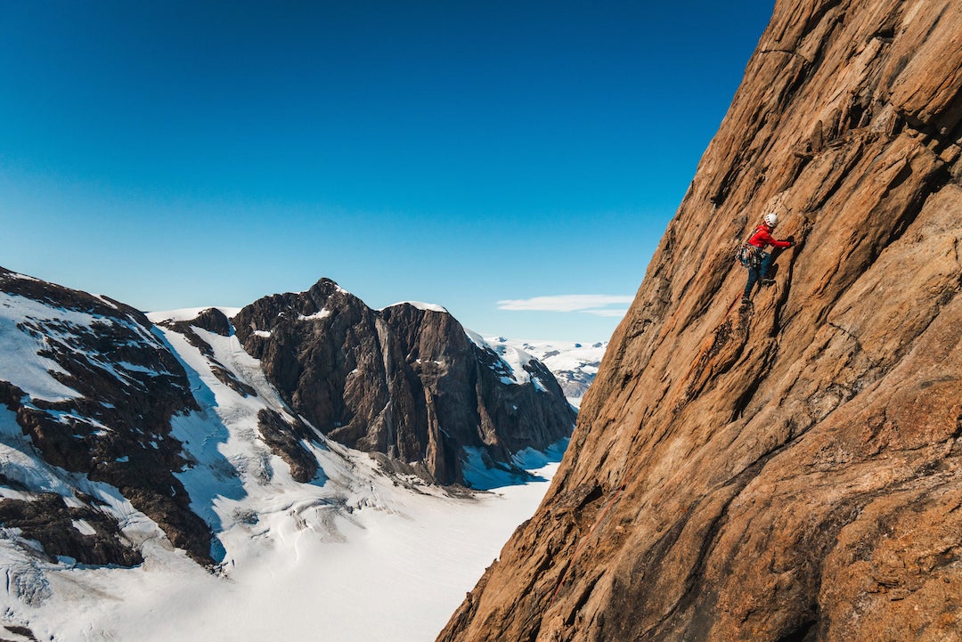 Pauline Laubscher on the first ascent of Ilumorpooq (670m, 6a), the first route up a formation the climbers named Les Droites, north of Graah Fjord in East Greenland. 