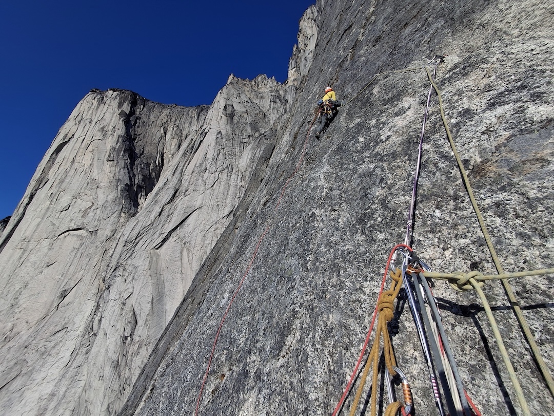 Mason Gardener leading up into the seam on the headwall on Ulamertorssuaq’s northwest face. 
