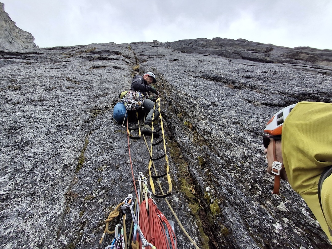 Liam Pyott starting up from the high point of the first attempt on Big Kumara. Vegetation was frequent up the first half of the seam, but the cracks were cleaner higher up. 