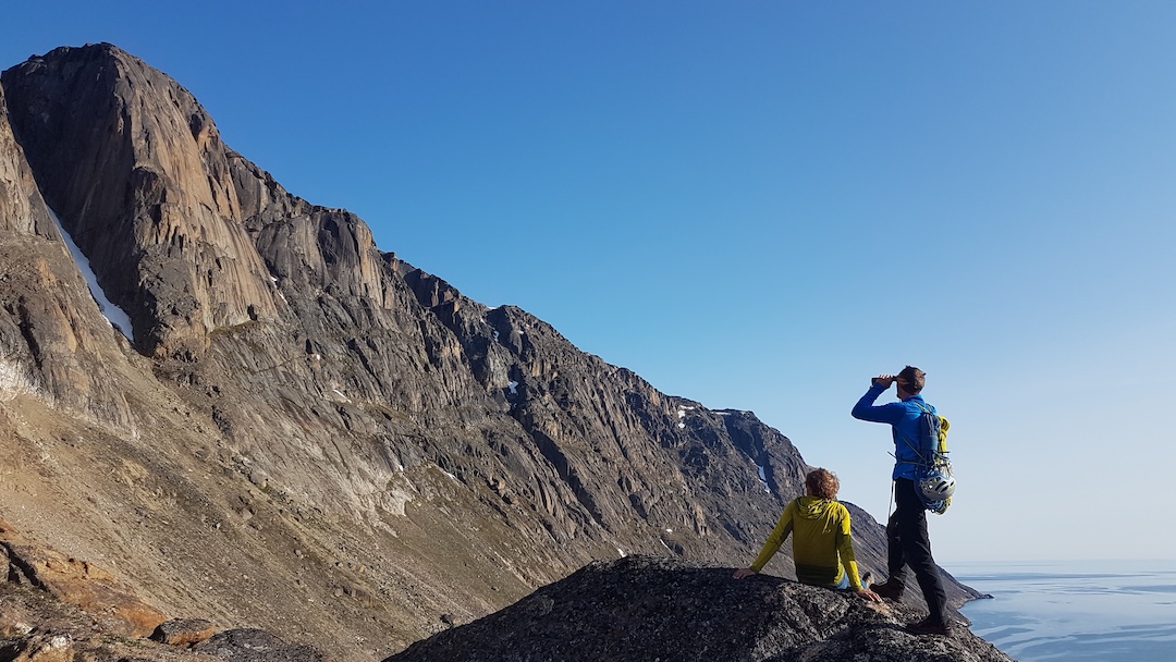 Michal Sabovčík (left) and Gabo Čmárik scope the 450-meter face on Qavdlunât (Qallunaat) on which they climbed the route Insomnia (UIAA VII-) in July 2019. 