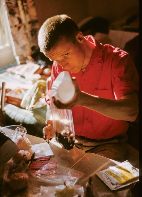 Wren packing supplies for the Southeast Spur of Denali expedition in 1962. 
