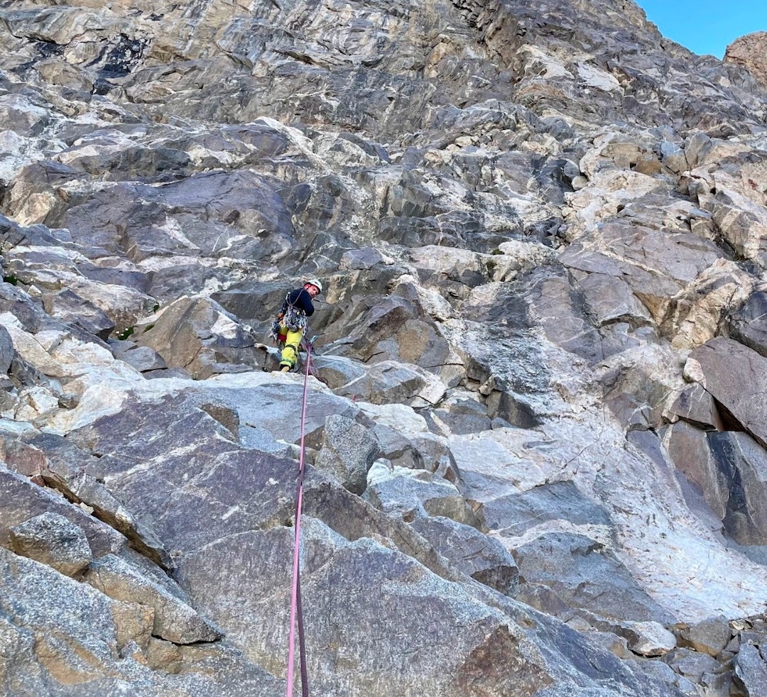 The first section is complete, but the climb is only beginning. The weather is still favorable. The lower part of the route is exposed to rockfall from adjacent couloirs once the sun reaches them, so the team is eager to move quickly through this hazard zone to higher ground, where the risk of rockfall is significantly lower.