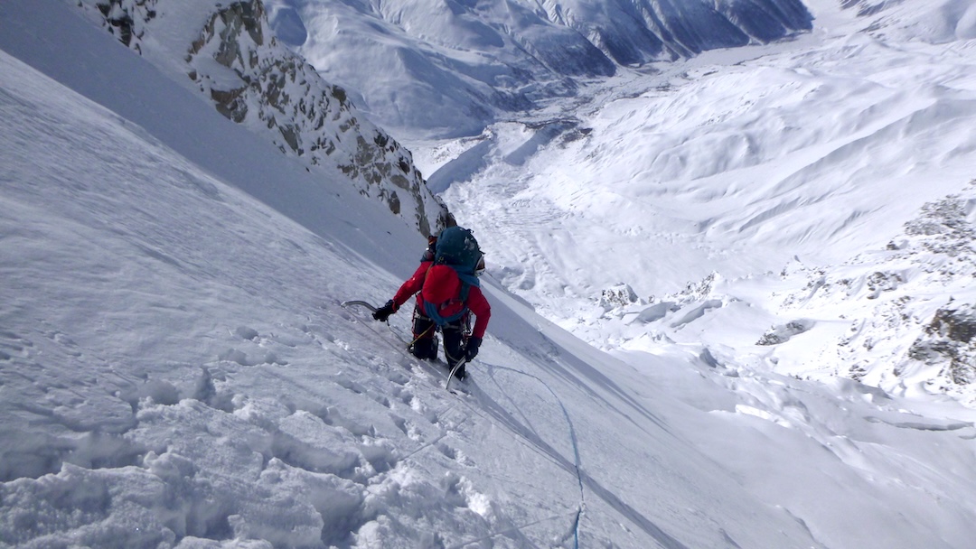Climbing through deep snow at the start of the upper ice wall on Shkhara. 