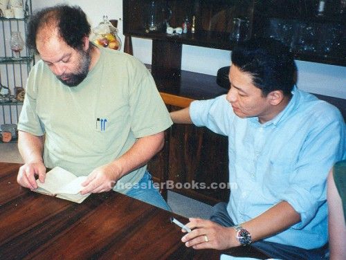 Michael with Jamling Tenzing, son of Tenzing Norgay, Everest summitter with Sir Edmund Hillary. He is showing Michael Chessler his father's Porter Book, signed by Hugh Ruttledge, who led expeditions to Everest in 1933 and 1936, and by Eric Shipton and Bill Tilman. 