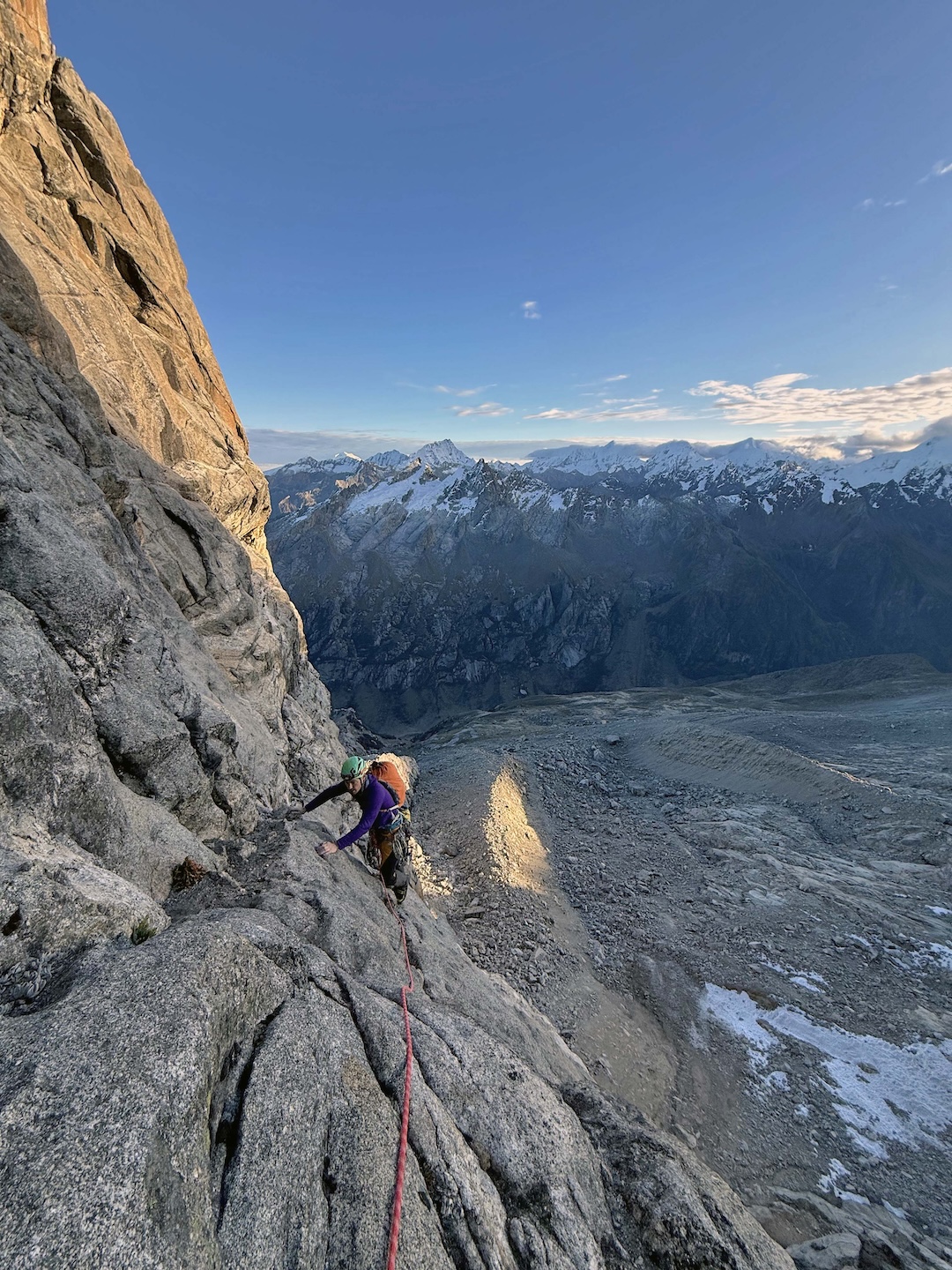 Manuel Lopez traversing after pitch four on the new route Carlos Suarez on the northeast face of Cashan Oeste.