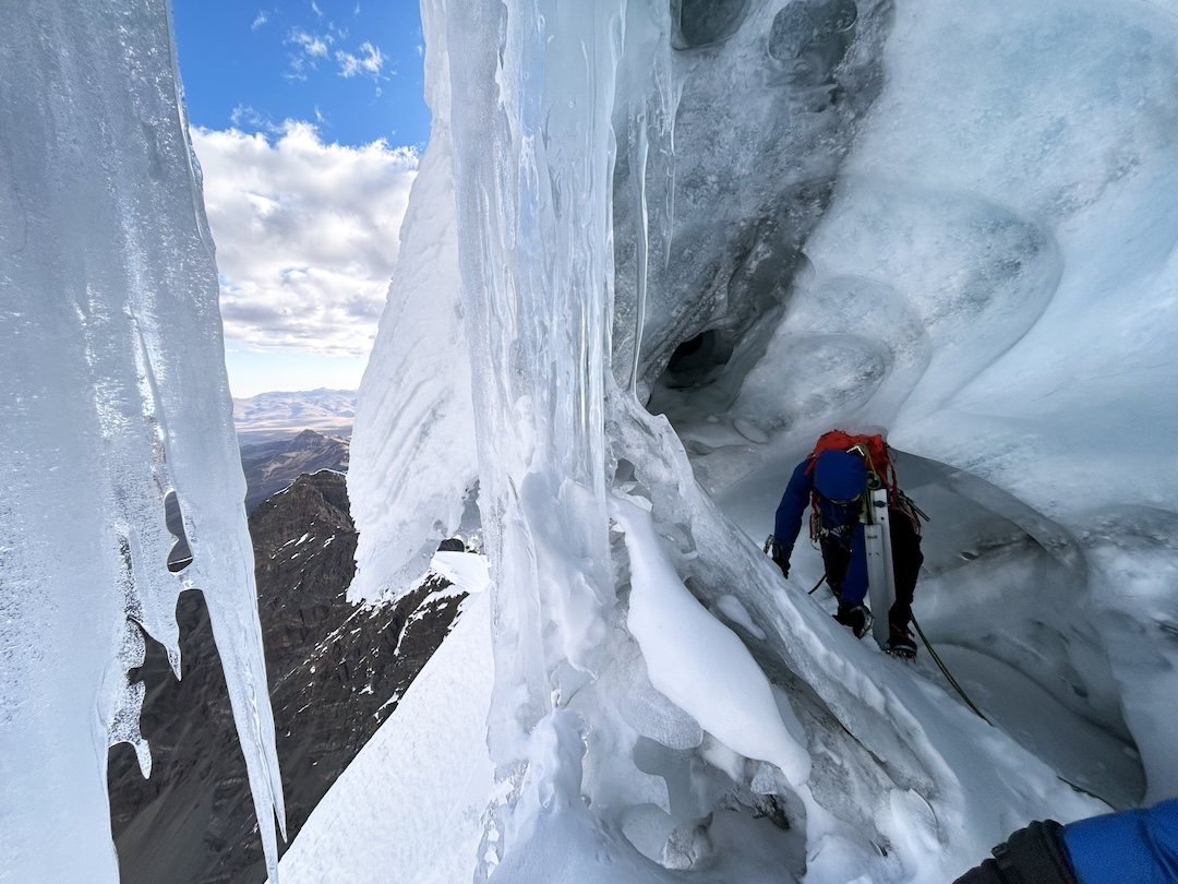 Entering the tunnel that allowed the right-hand variant climbers to move beneath the serac and exit the south face. 