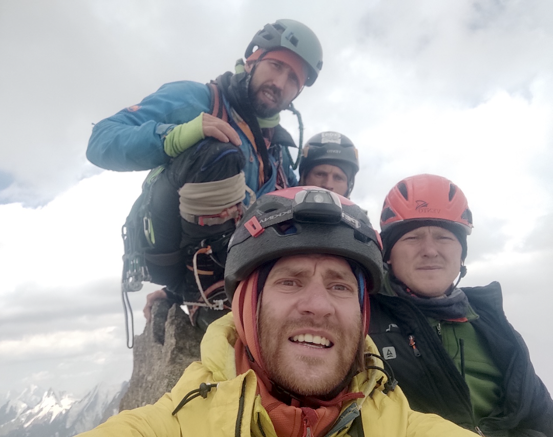 On Svarog’s summit gendarme, left to right: Egor Matveenko, Evgeny Korulin, Artem Pivovarchik, and Tikhon von Stackelberg. 
