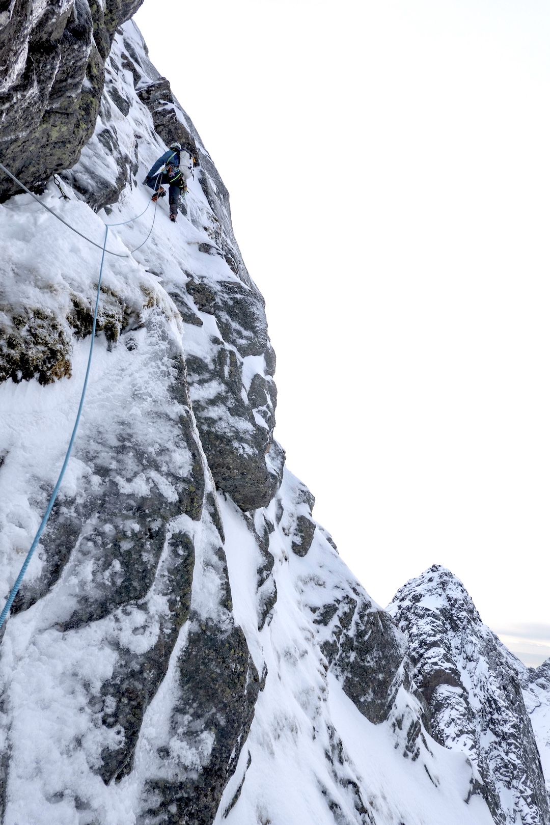 Stian Bruvoll on a classic Lofoten mix of granite, snow, ice and moss high on Kråkhammartinden’s Follow the Rabbit. The route name came after the team followed rabbit tracks to navigate the maze of streams and boulders on the approach.
