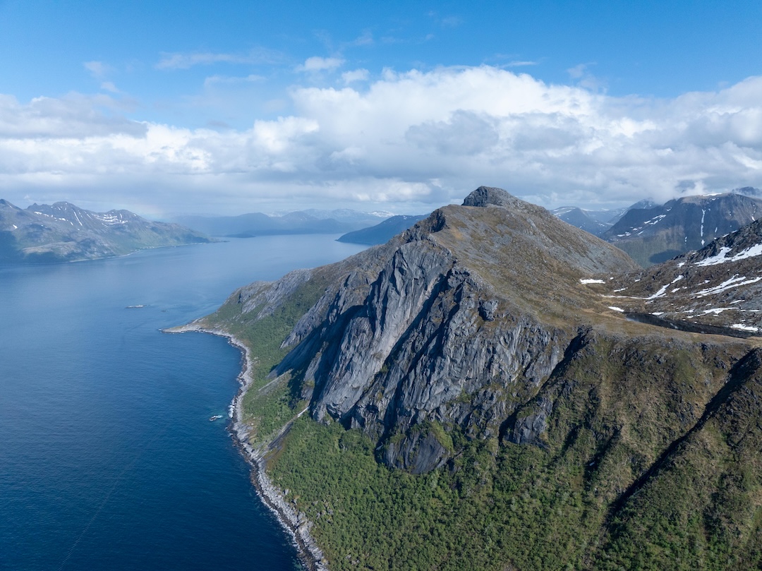 Tromma is the clean, central buttress, facing northwest. The approach takes about 1.5 hours. 