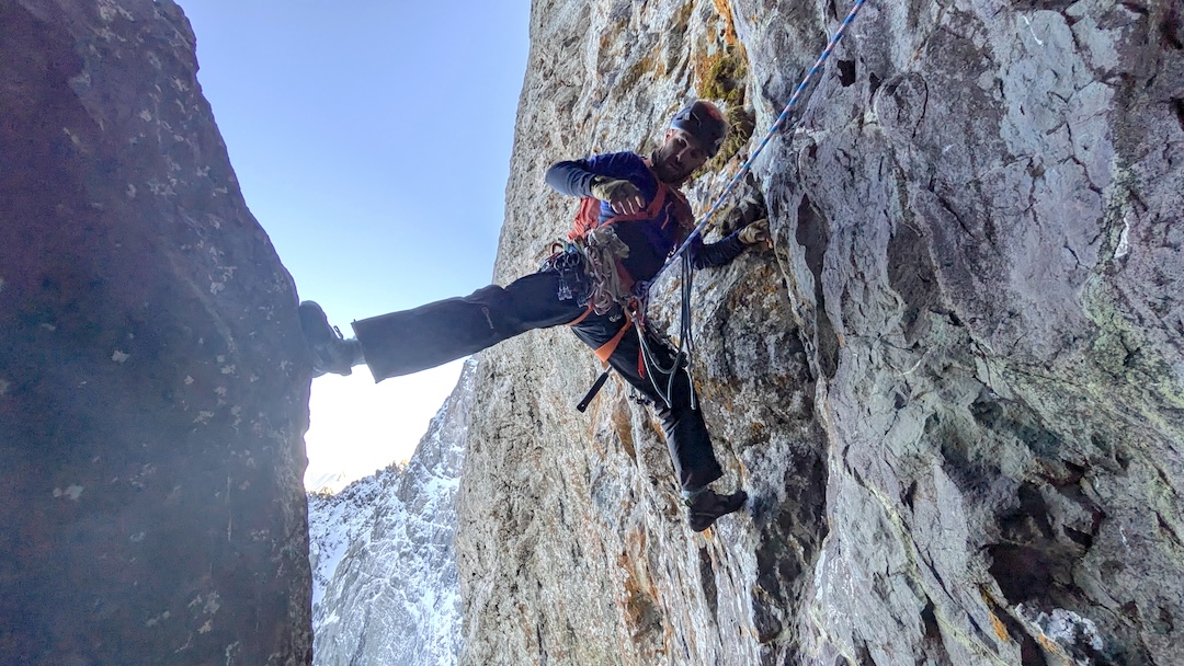 Giorgi Tepnadze climbing in the huge chimney followed by the 2024 route up the east face of Asatiani.
