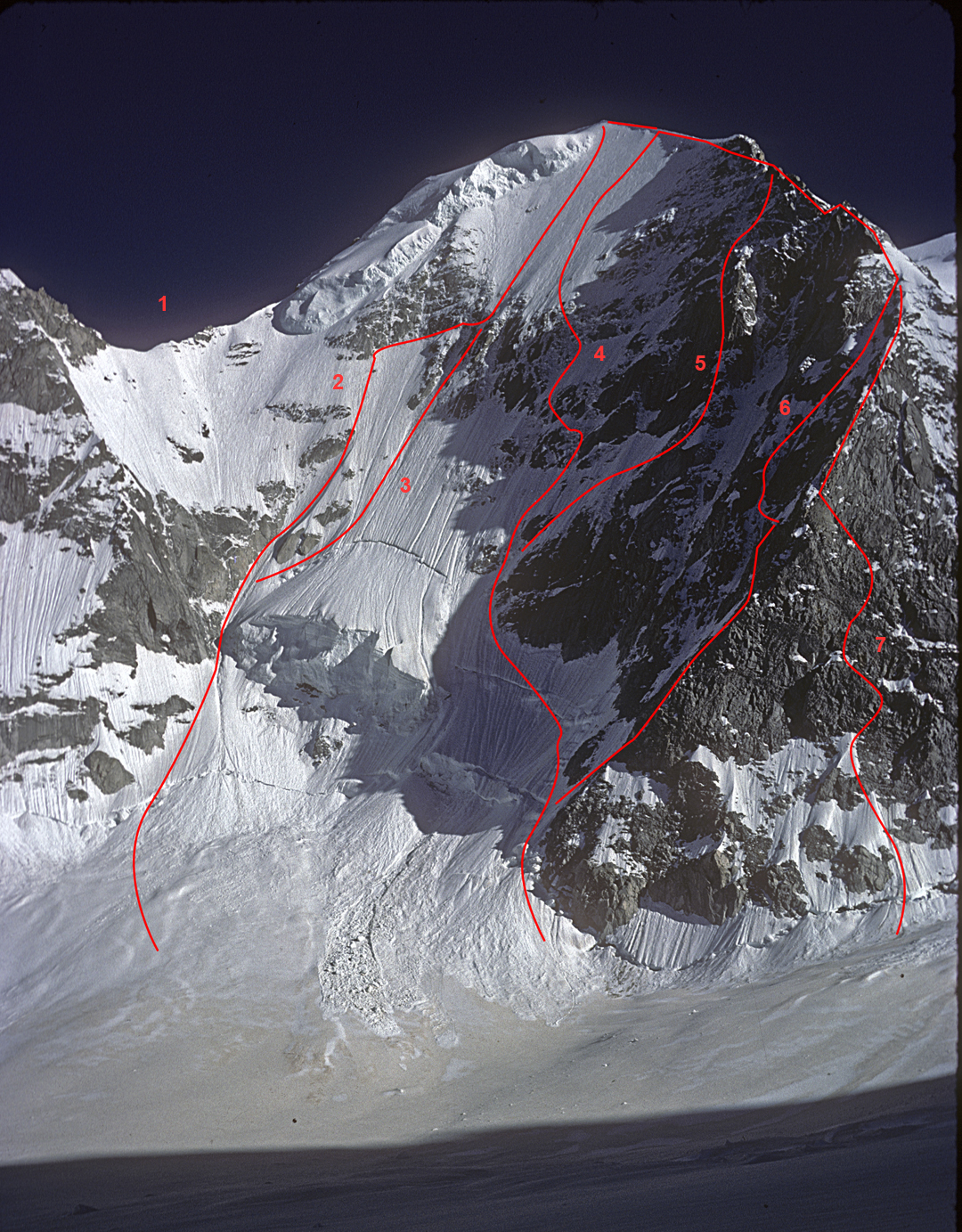 The north face of the Nesthorn in the snowy conditions of yesteryear. (1) Northeast Ridge (1984). (2) Welzenbach Route (1933). (3) British Route (1973, only possible in very snowy conditions). (4) British Route (1977). (5) Imstepf Route (1986). (6) North-northwest Ridge (1905). (7) Cuckoo's Nest (2005). Nesthakchen (2025) lies off picture to the right but joins the north-northwest ridge just above the intersection of 6 and 7. 