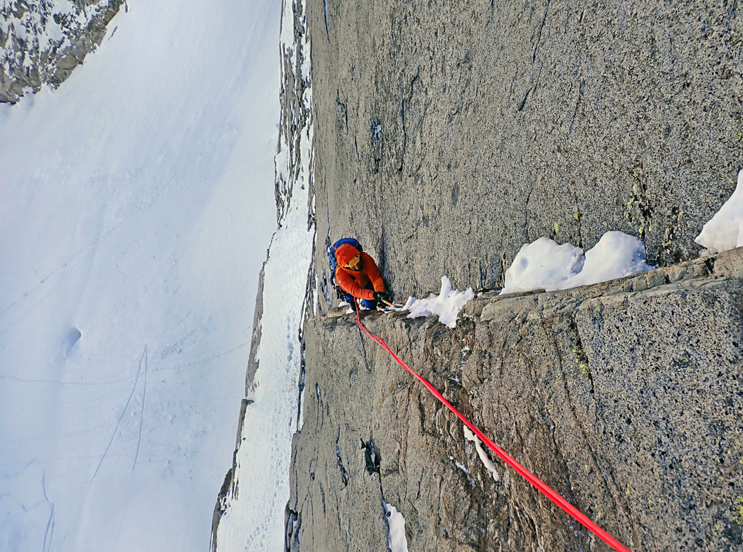 Stefano Falezza follows the diagonal crack (M6+) during the first winter ascent of the Dell'Eva-Taddei route on the north face of Cima Busazza. 