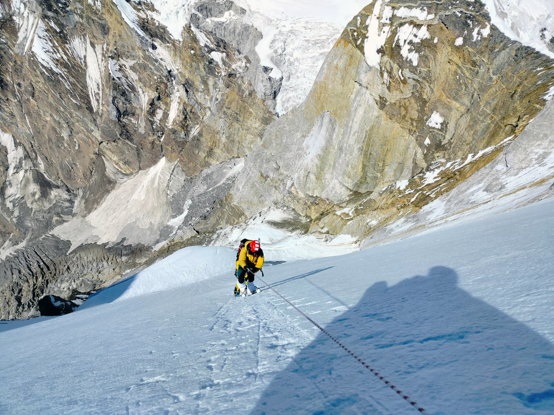 High on the west face of Meru in 2023 with the upper Kirti Glacier far below. 