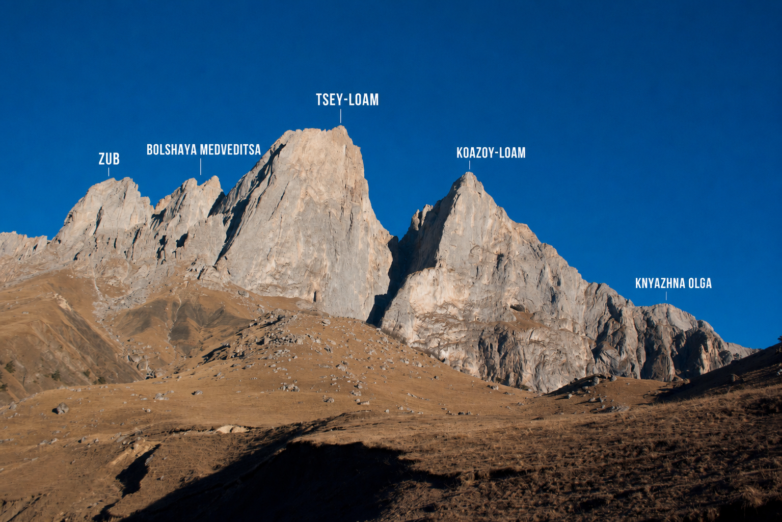 View of the Tsey Loam group above the Dzheyrakh Valley, showing Zub, Bolshaya Medveditsa, Gaikomd, and Koazoy Loam, with Knyazhna Olga on the far right. 