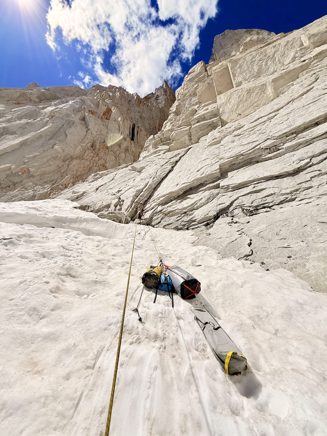 Harry Kinnard at the belay station at the start of the Stoned Ape Hypothesis (18 pitches, VI 5.13a AO), hauling gear ahead of his and Myles Moser’s first ascent of the route. 