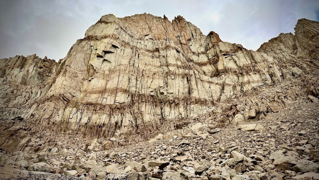 Buns of Steel (7 pitches, IV 5.11b) is marked in yellow on the left side of Iridescent Wall. Other routes are not shown. 