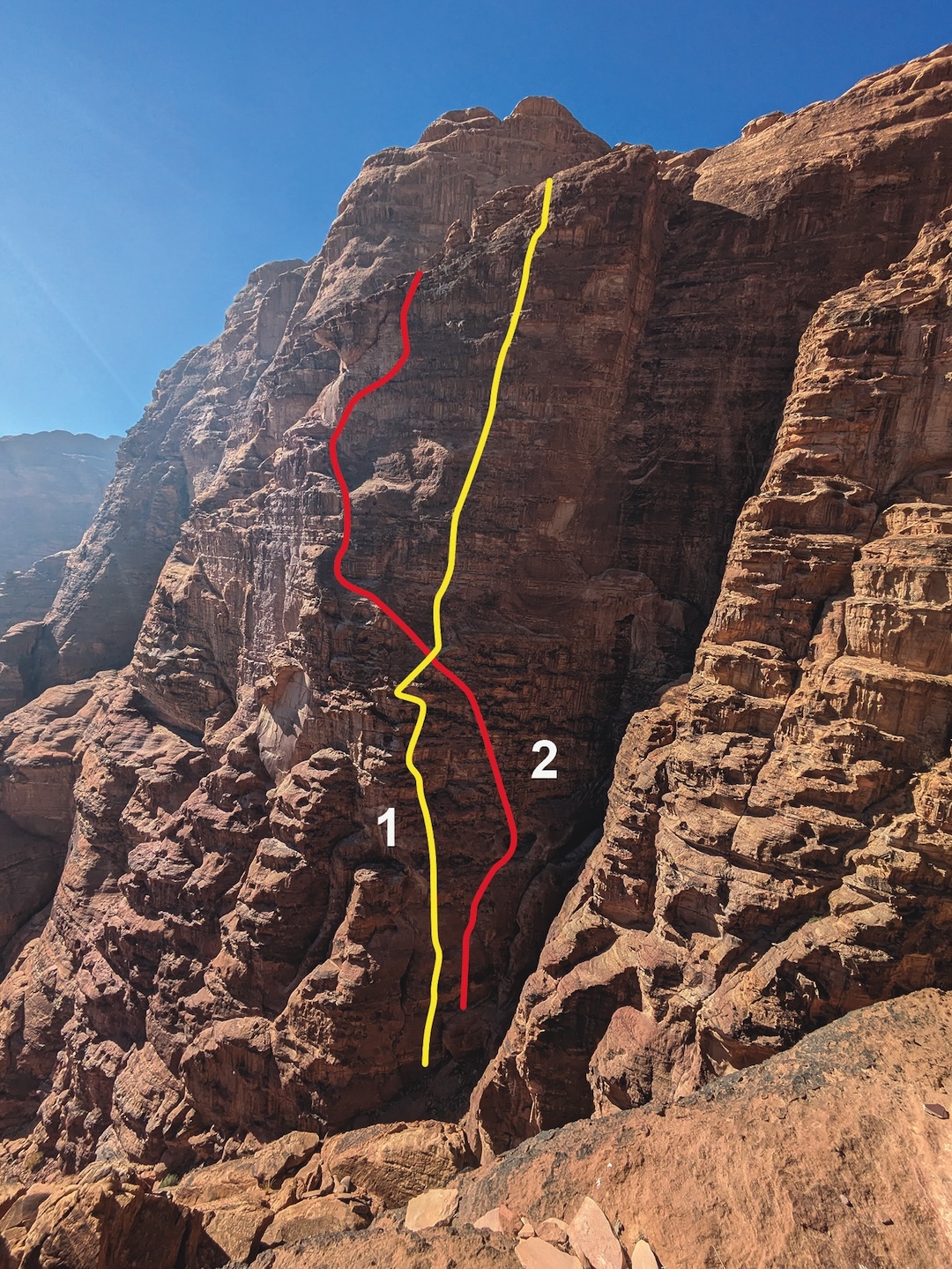 (1) Salam (IV 5.11c, 2025) on Jebel Rum. (2) Roumi Soit Qui Mal y Pense (6b, 2003). Hyperglycemia (7c, 2023) is to the right of both routes.  
