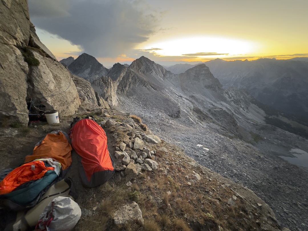 Sunrise on the bivy ledge at the end of pitch three on A Beast the Color of Winter (7 pitches, 800’, IV 5.12b) on the east face of Goat Peak. 