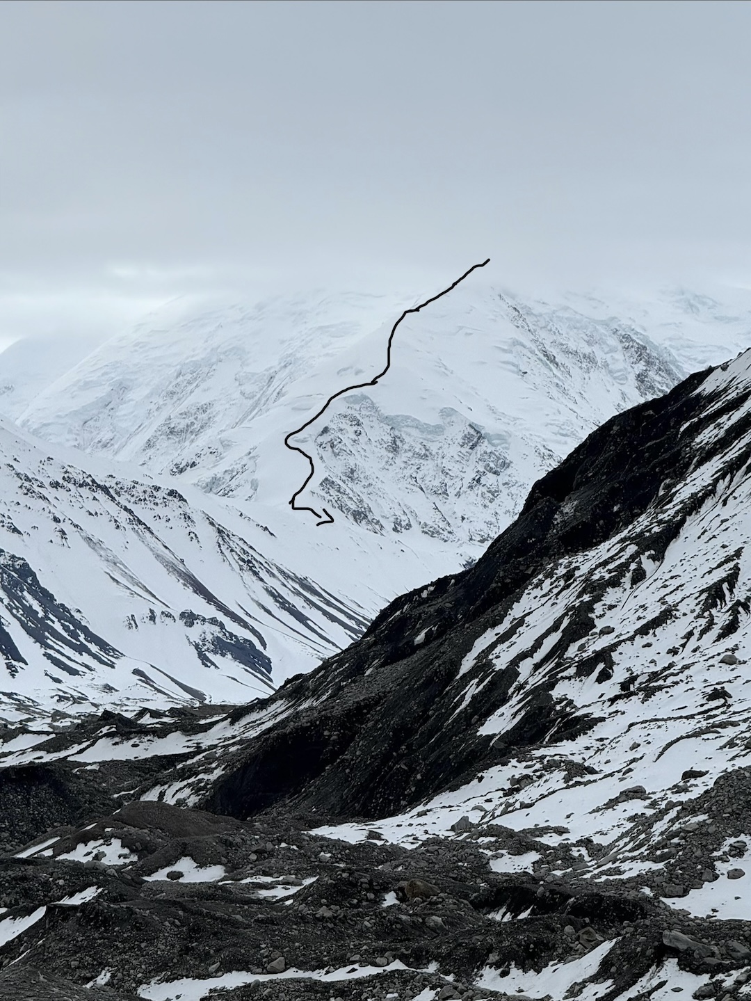 The line of the ski descent off the northwest side of the Mt. Crosson group, seen from the Foraker Glacier. 
