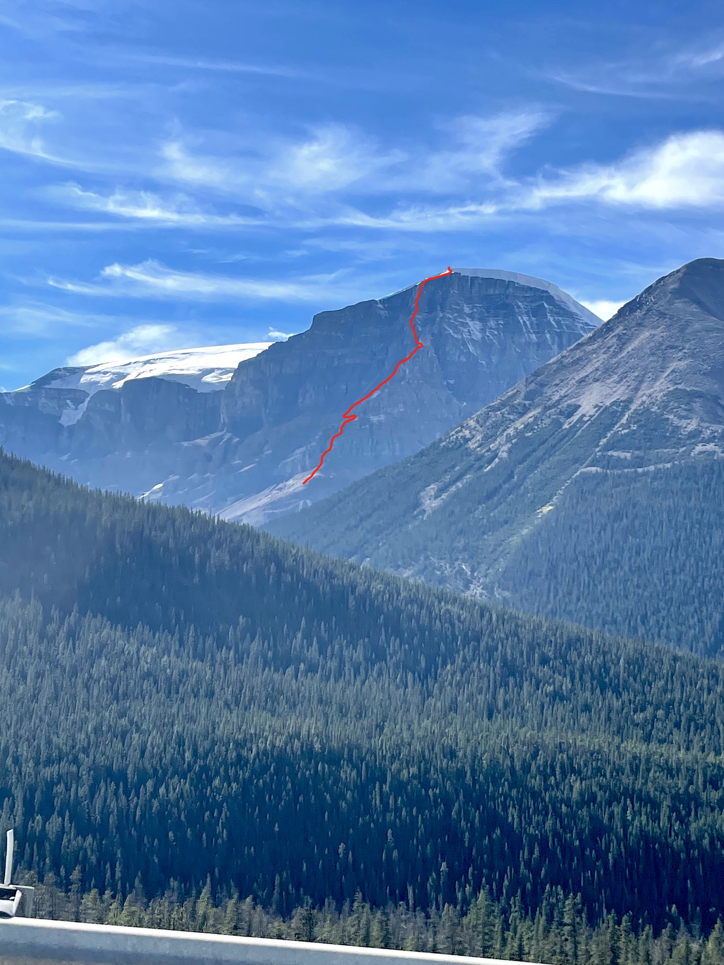 The line of No Fiesta, No Siesta (1,200m, TD- 5.8) on the east ridge of Stutfield Peak East. The main summit is off to the left. 
