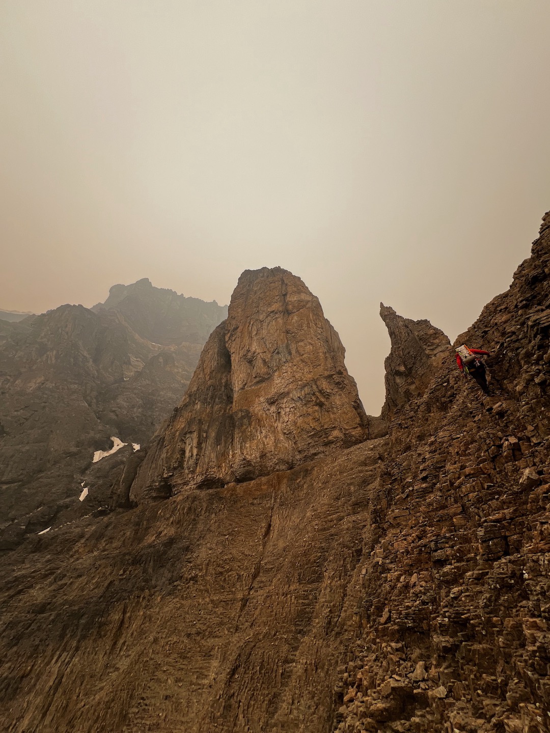 Nick Baggaley scrambling to the base of the final tower on the east ridge of Stutfield Peak East. 
